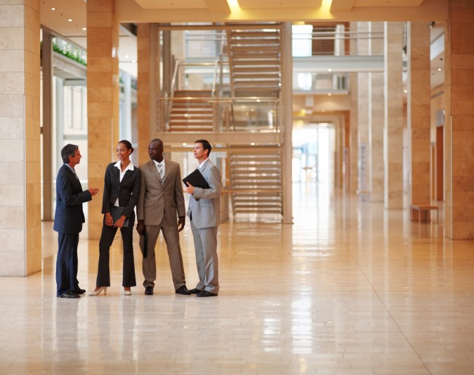 photodune-183218-team-of-successful-business-people-standing-at-a-hallway-m